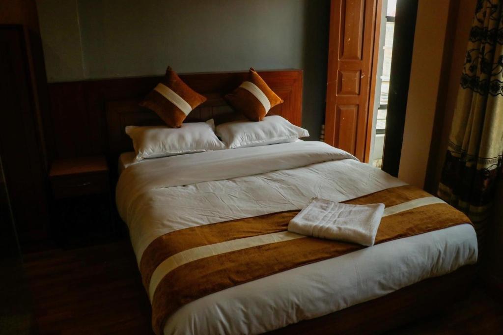 Postel nebo postele na pokoji v ubytování Harry's Home