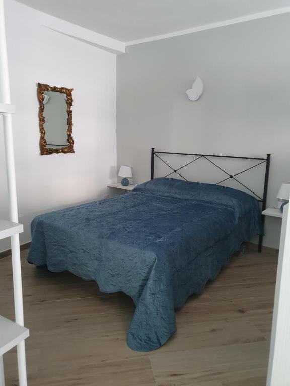 Posteľ alebo postele v izbe v ubytovaní LA CASA DI IA