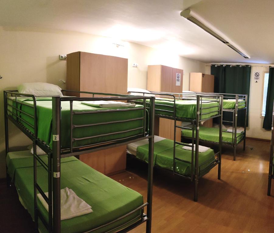 Postel nebo postele na pokoji v ubytování Guest House Barcelona Bruc