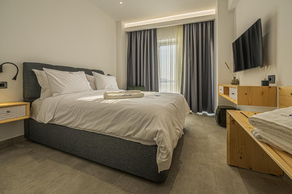 Postel nebo postele na pokoji v ubytování ELA apartments