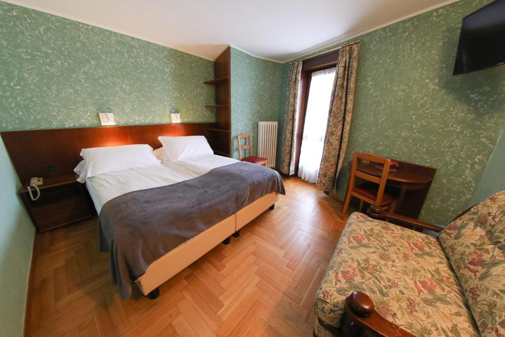 Cama ou camas em um quarto em HOTEL SPORTING