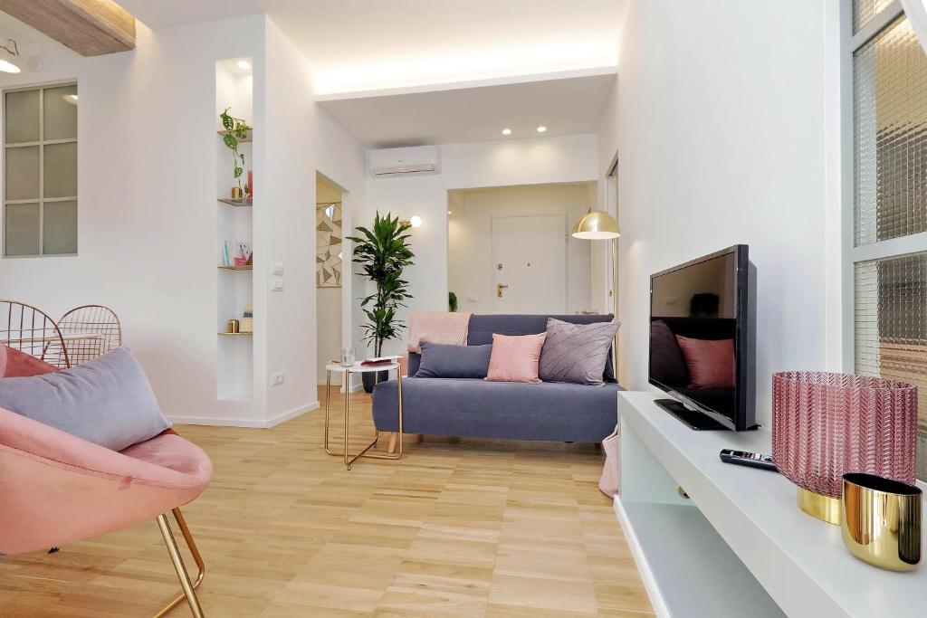 Televízia a/alebo spoločenská miestnosť v ubytovaní YCH-Glamour flat