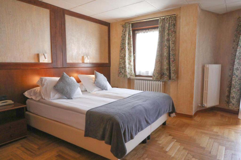 Cama ou camas em um quarto em HOTEL SPORTING