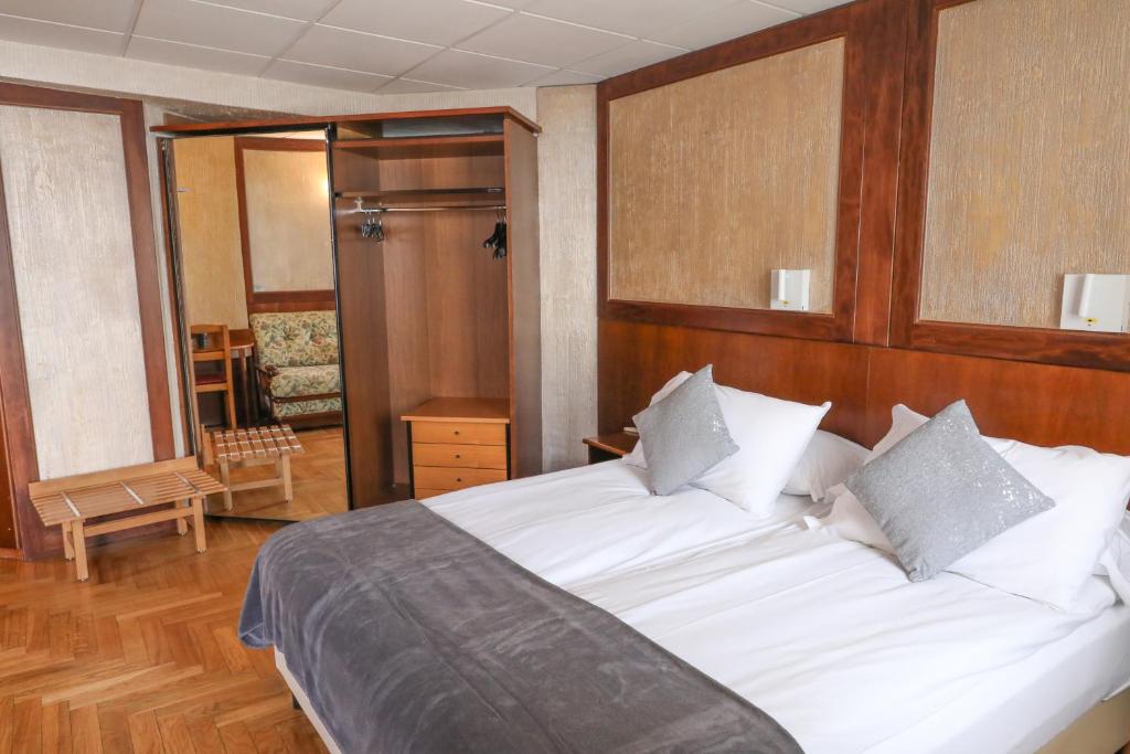 Cama ou camas em um quarto em HOTEL SPORTING