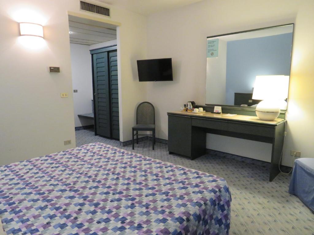 Postel nebo postele na pokoji v ubytování Hotel Turandot