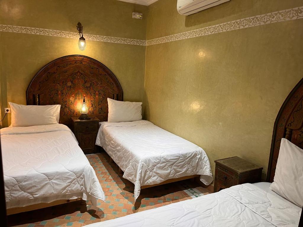 Postel nebo postele na pokoji v ubytování Riad Ritaj