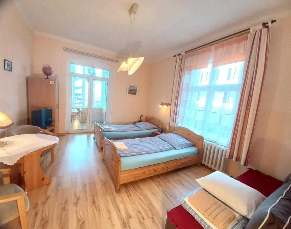 Postel nebo postele na pokoji v ubytování Apartamenty Maria