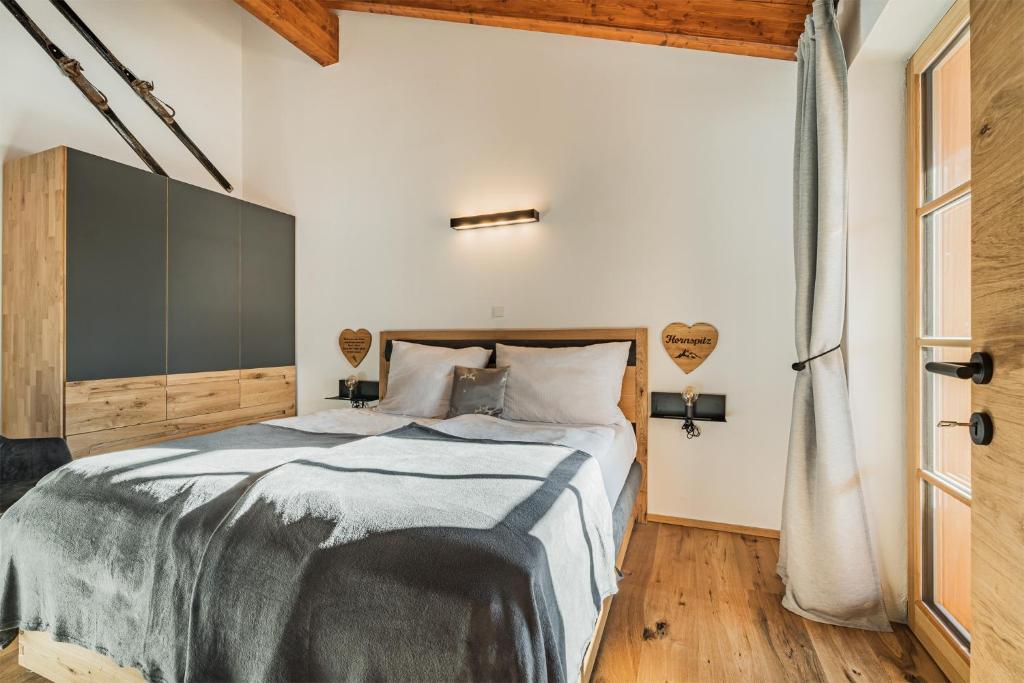 Postel nebo postele na pokoji v ubytování Dachstein West Apartment T5