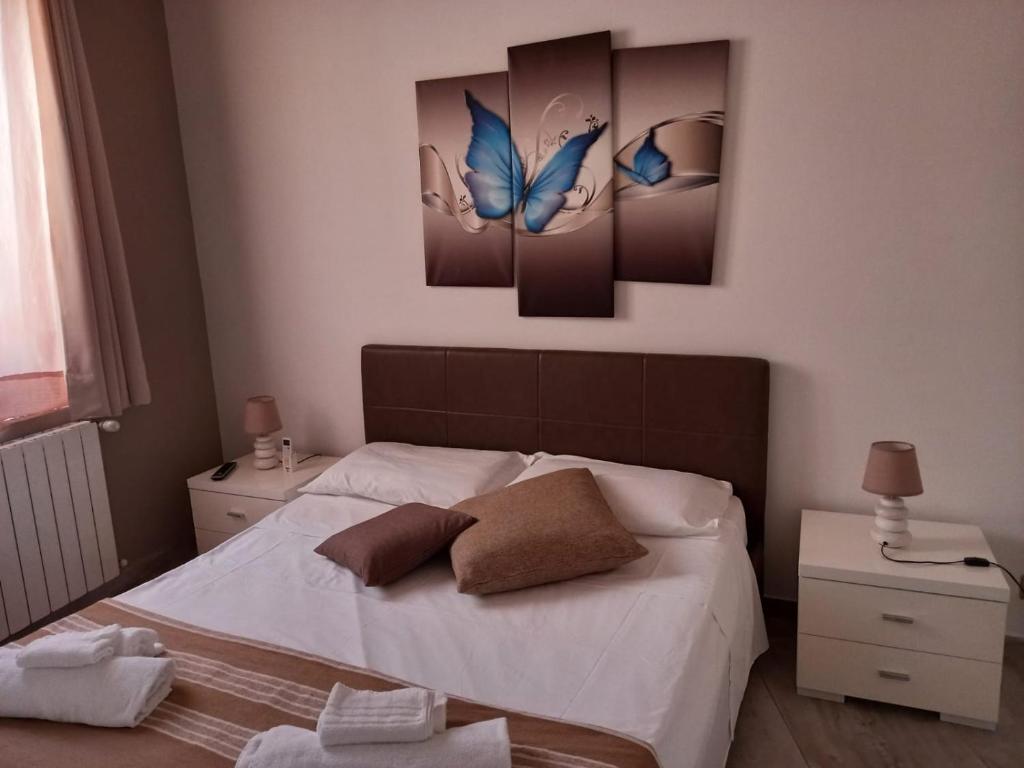 Posteľ alebo postele v izbe v ubytovaní Vittorio Emanuele Appartamenti George
