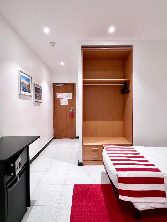 Postel nebo postele na pokoji v ubytování Hostal Apolo