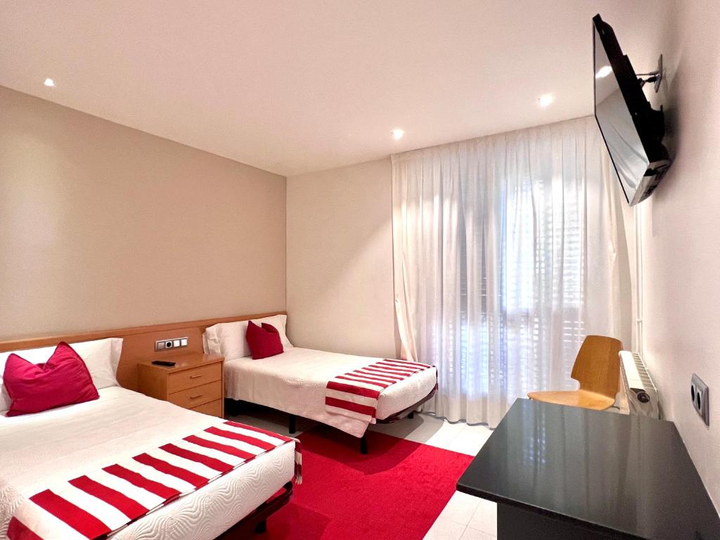 Postel nebo postele na pokoji v ubytování Hostal Apolo