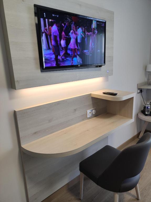 TV a/nebo společenská místnost v ubytování Berg'hotel