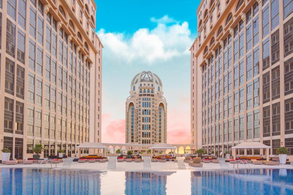 an architectural rendering of a hotel courtyard with buildings at Al Gassar Resort in Doha