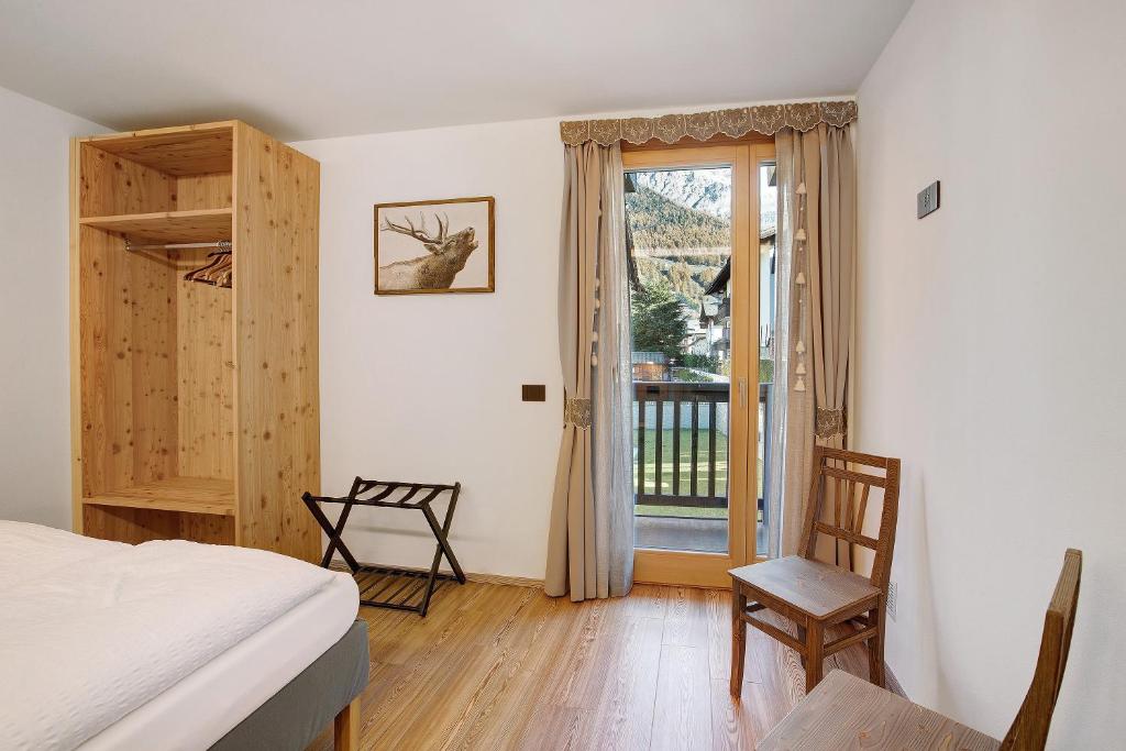 Posteľ alebo postele v izbe v ubytovaní Olympic Chalet 11