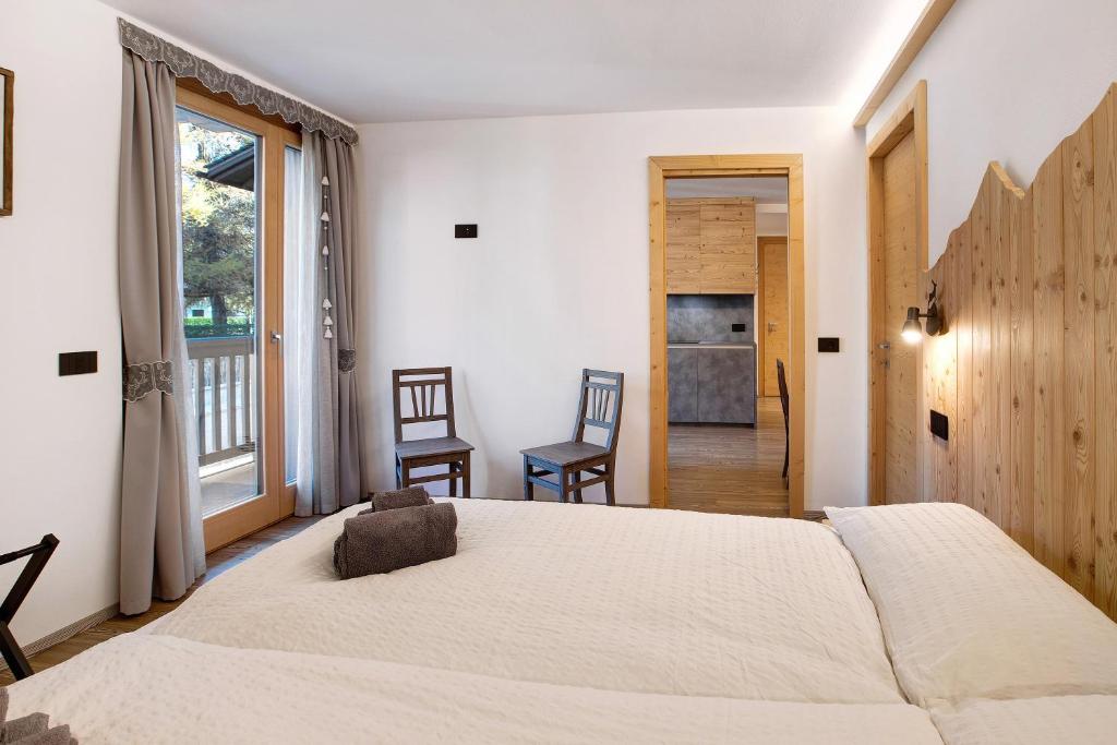 Posteľ alebo postele v izbe v ubytovaní Olympic Chalet 11