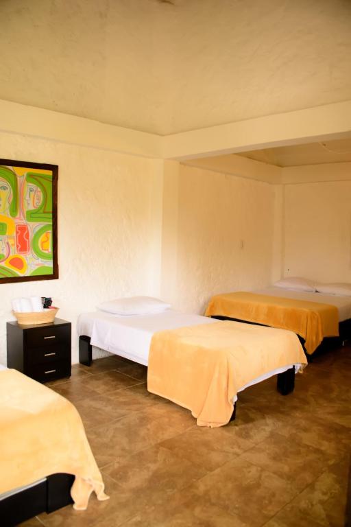 Postel nebo postele na pokoji v ubytování Finca Hotel Loma Verde
