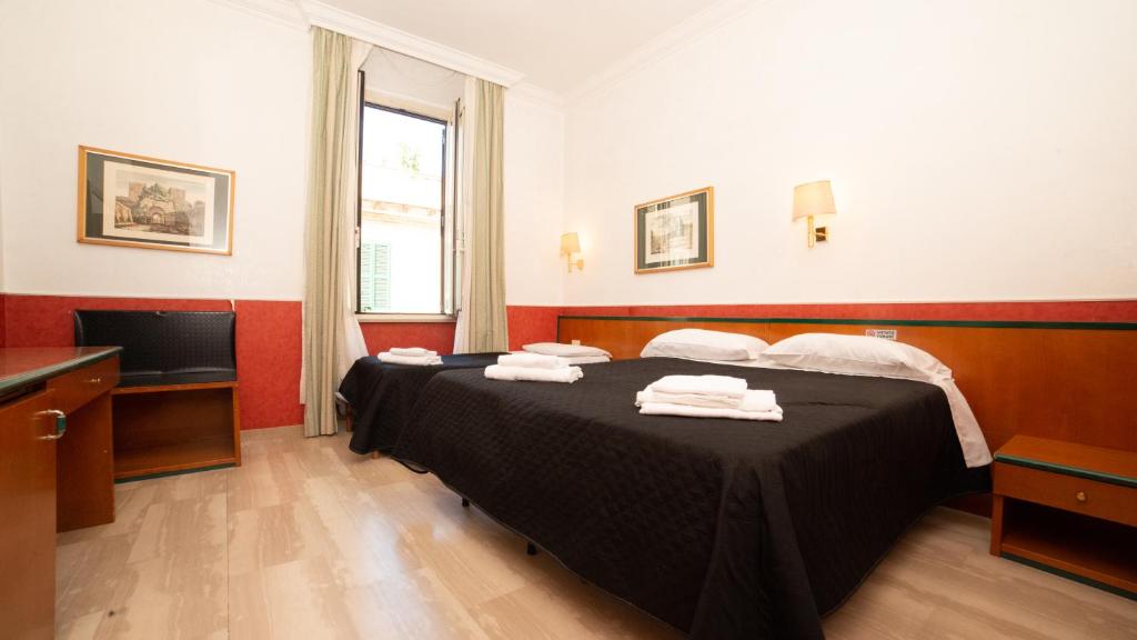 A bed or beds in a room at Hotel Center 1