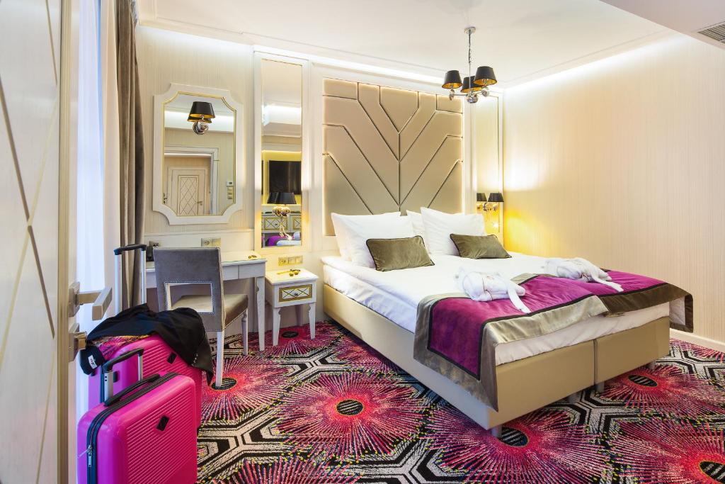 Łóżko lub łóżka w pokoju w obiekcie Hotel Royal Baltic 4* Luxury Boutique