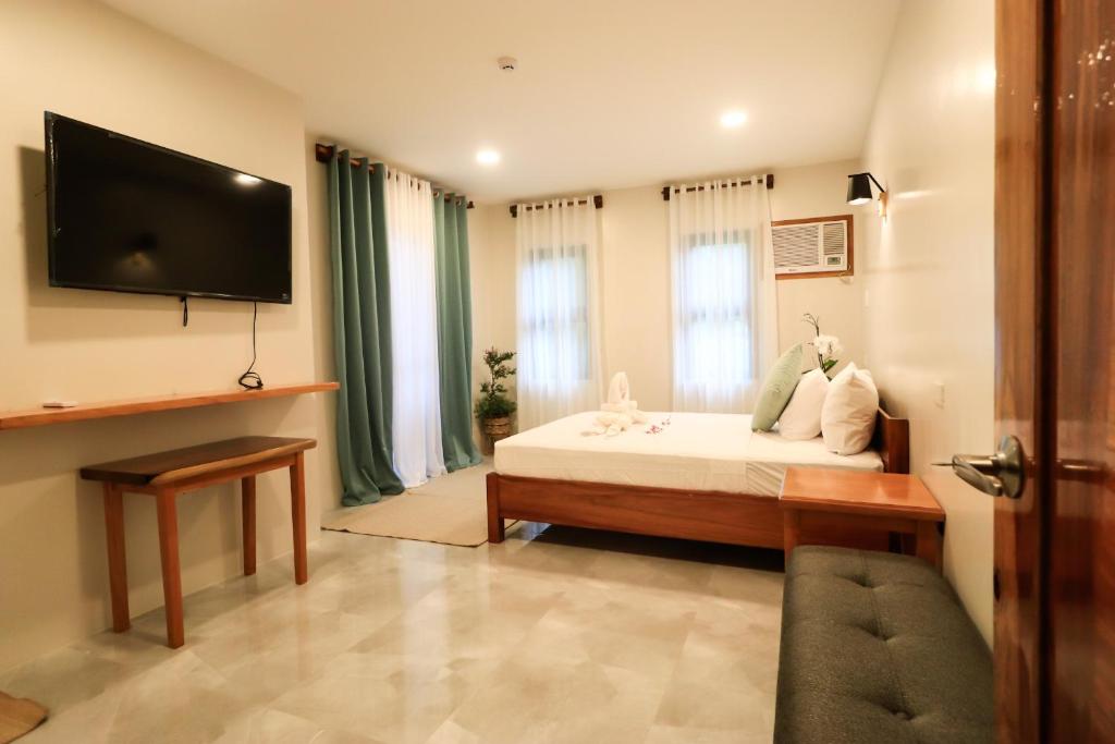 TV a/nebo společenská místnost v ubytování Josefina's Tourist Inn