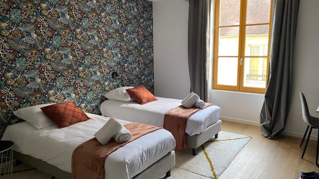 Postel nebo postele na pokoji v ubytování Hotel restaurant LA PLACE