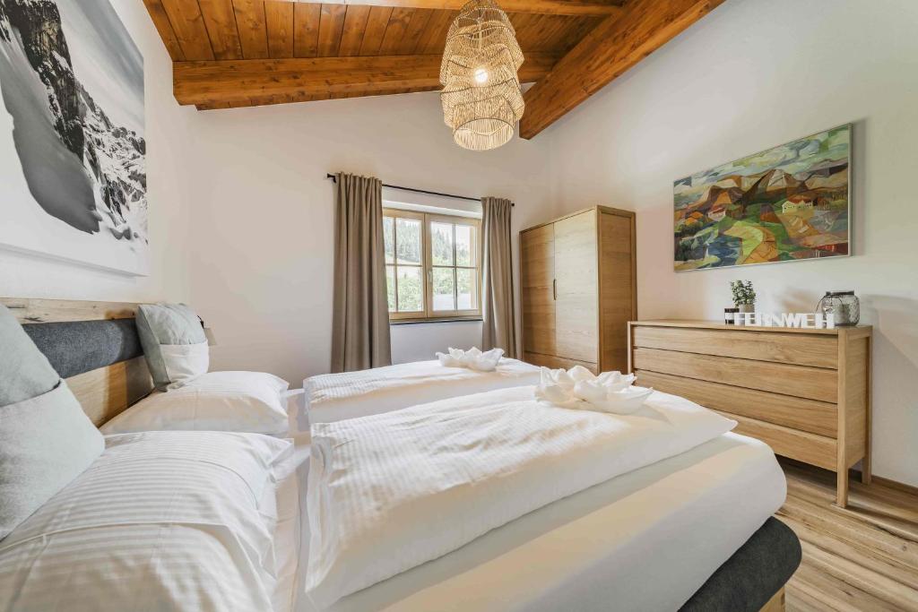 Postel nebo postele na pokoji v ubytování Dachstein West Apartment T4