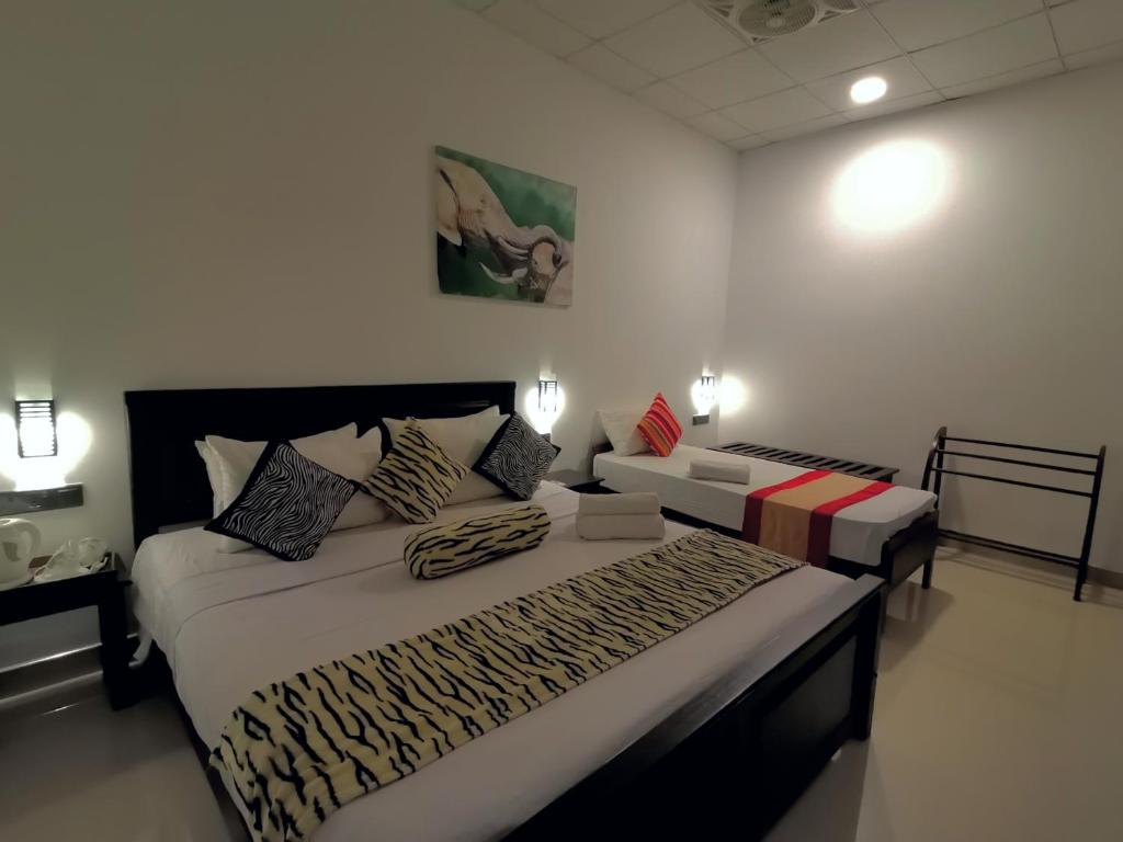 Postel nebo postele na pokoji v ubytování Levona Garden Resort