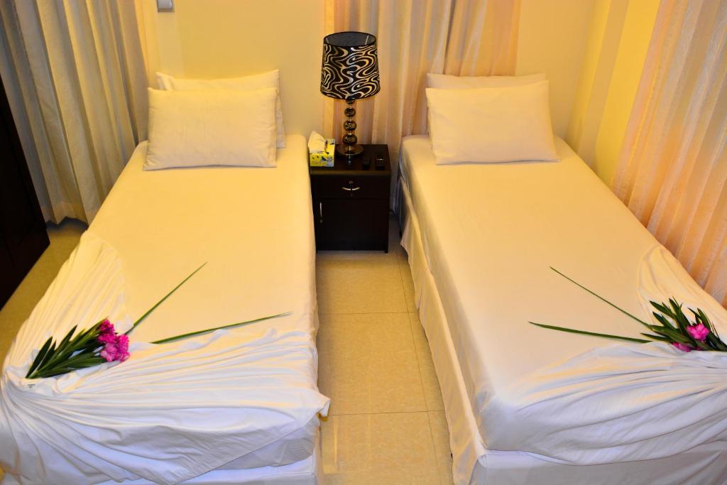 Postel nebo postele na pokoji v ubytování Beach Palace