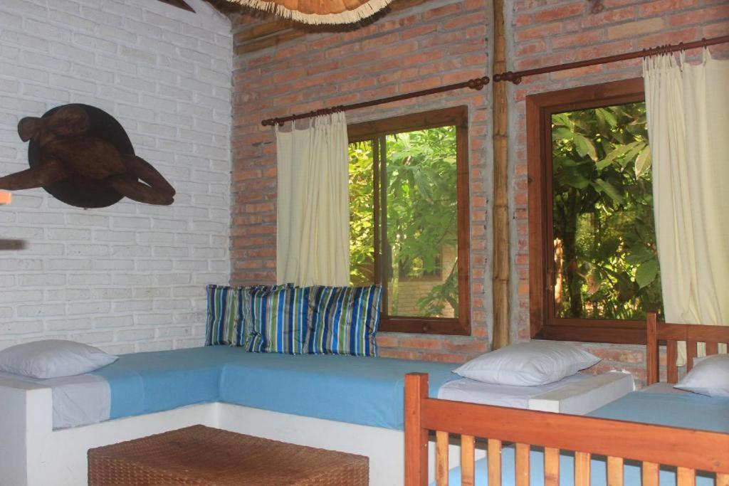 Postel nebo postele na pokoji v ubytování El Campito Lodge