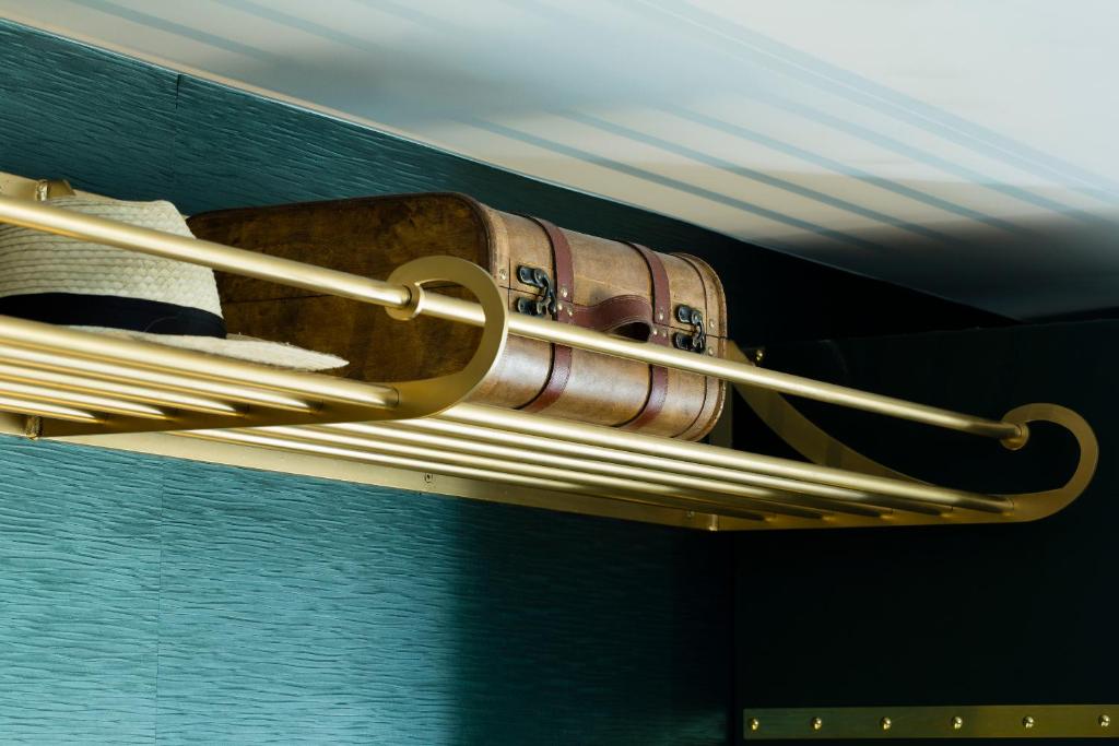 a light with a suitcase on a shelf at Hotel Whistler - Gare du Nord in Paris