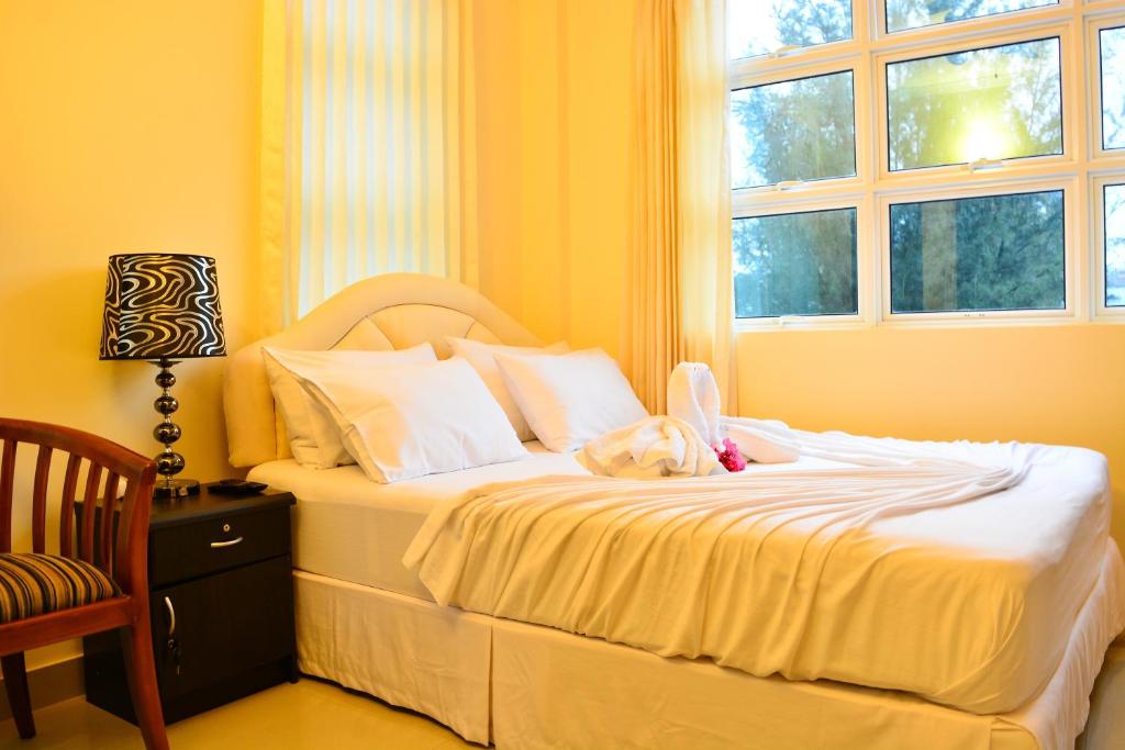 Postel nebo postele na pokoji v ubytování Beach Palace
