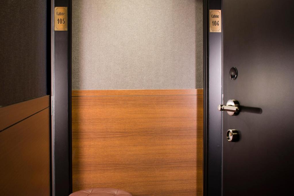 a door that is open to a room at Hotel Whistler - Gare du Nord in Paris