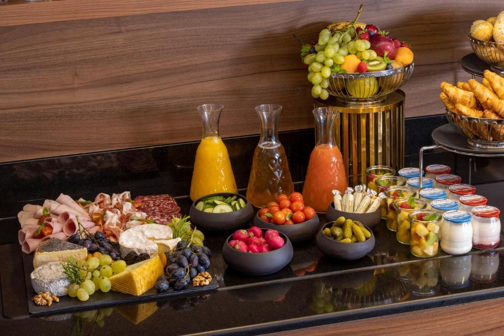 a tray filled with different types of fruits and vegetables at Hotel Whistler - Gare du Nord in Paris