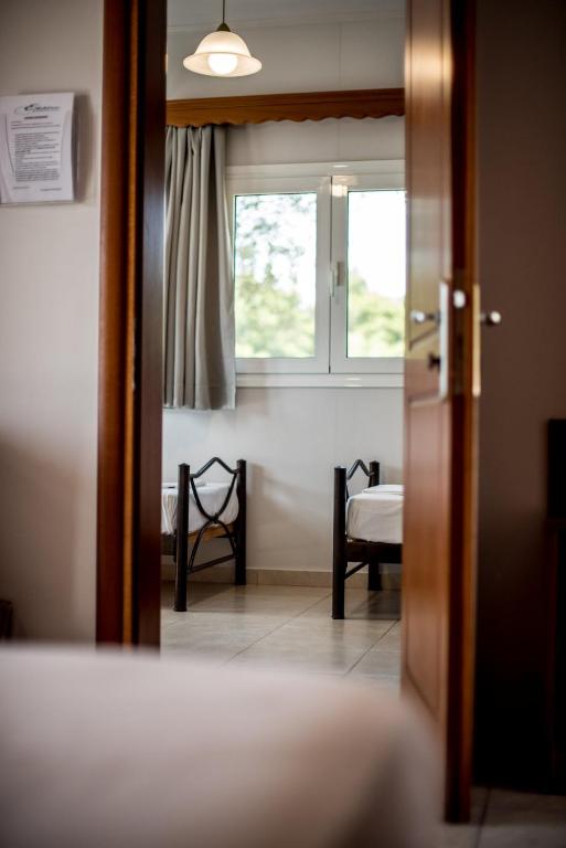 Postel nebo postele na pokoji v ubytování Elektra Hotel