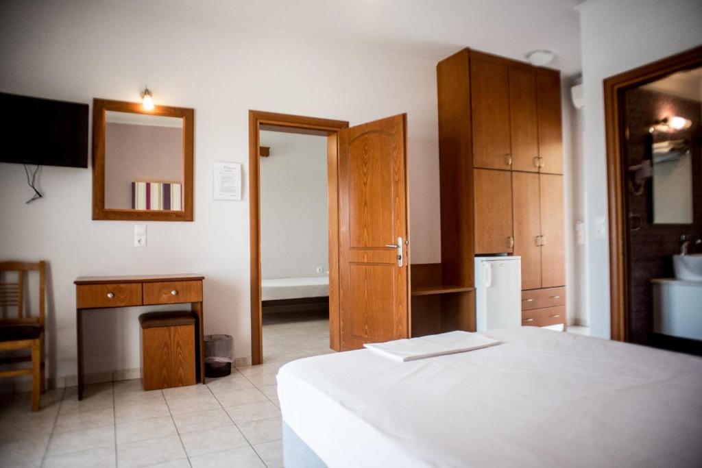 Postel nebo postele na pokoji v ubytování Elektra Hotel