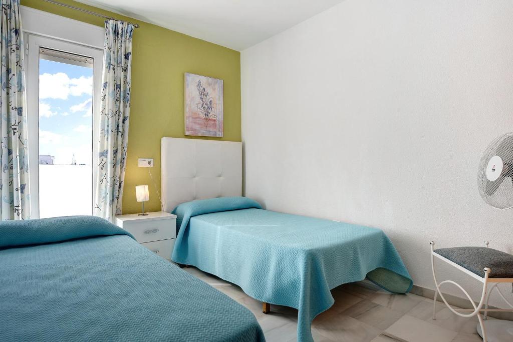 Postel nebo postele na pokoji v ubytování Dúplex Tejar C con Piscina Familias
