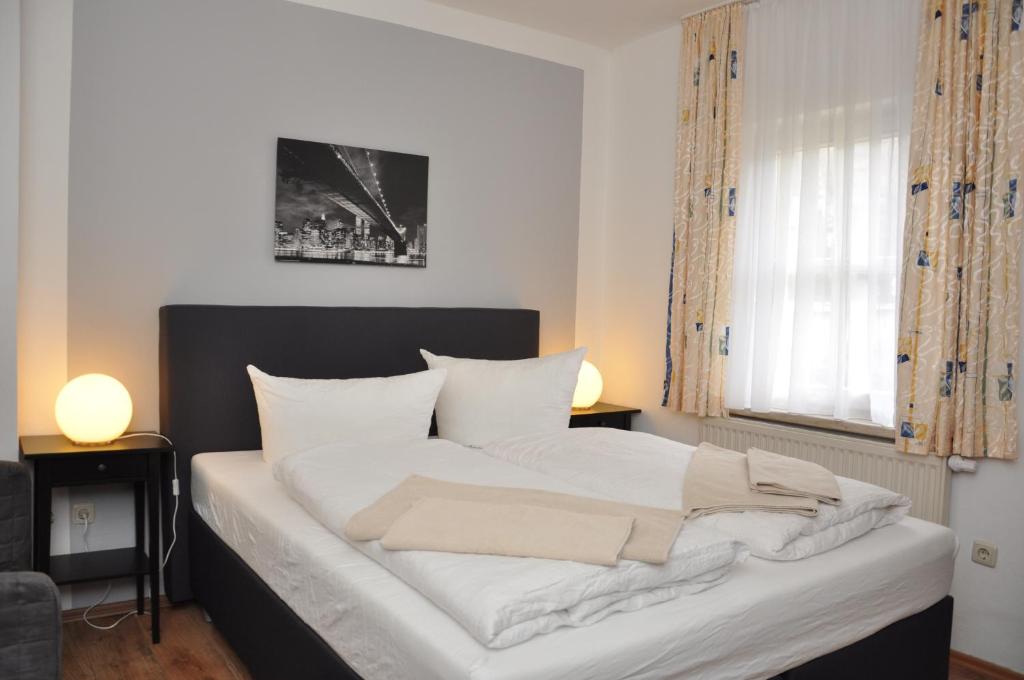 Postel nebo postele na pokoji v ubytování Hotel Wolke