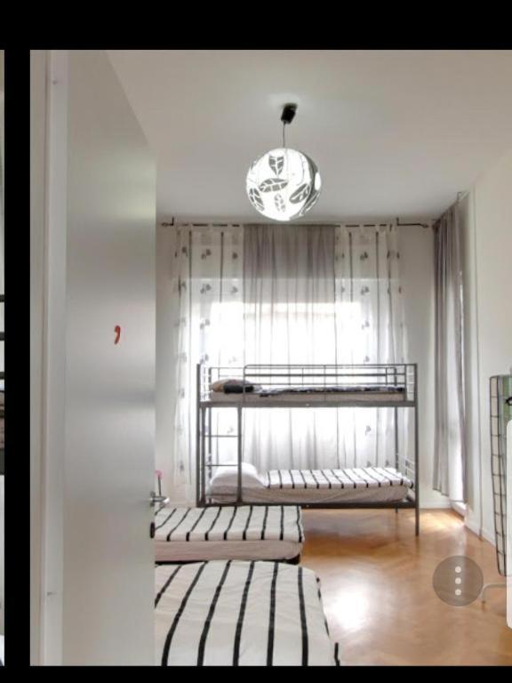 Postel nebo postele na pokoji v ubytování Family Hostel Milano