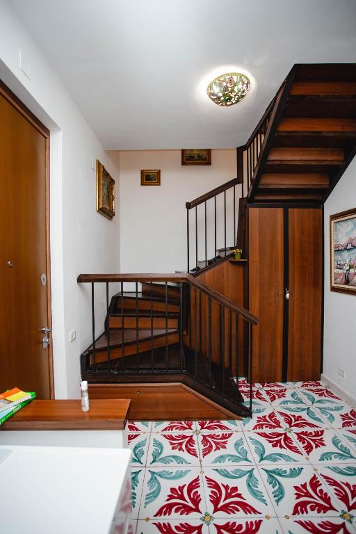 A bed or beds in a room at Delfini Trevi House