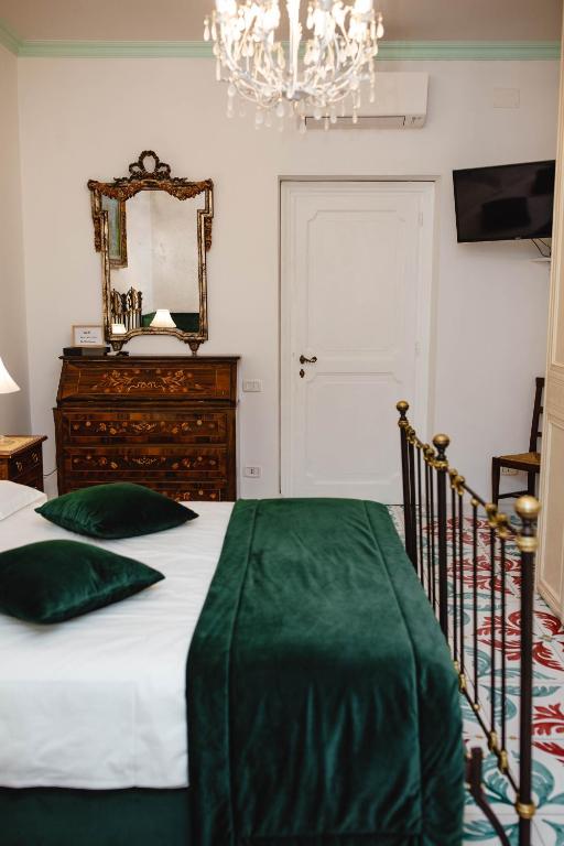 A bed or beds in a room at Delfini Trevi House