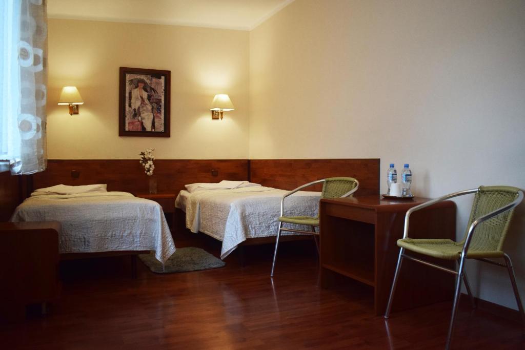 Posteľ alebo postele v izbe v ubytovaní Hotel Skaut