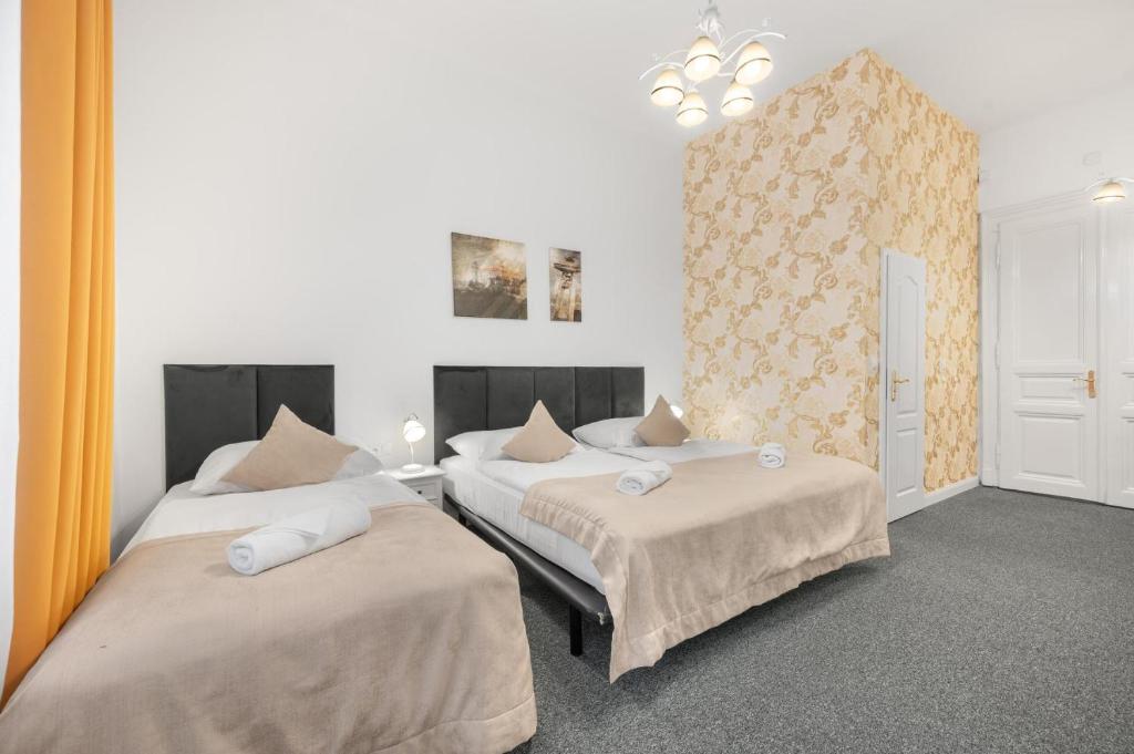 A bed or beds in a room at Downtown Bratislava B&B