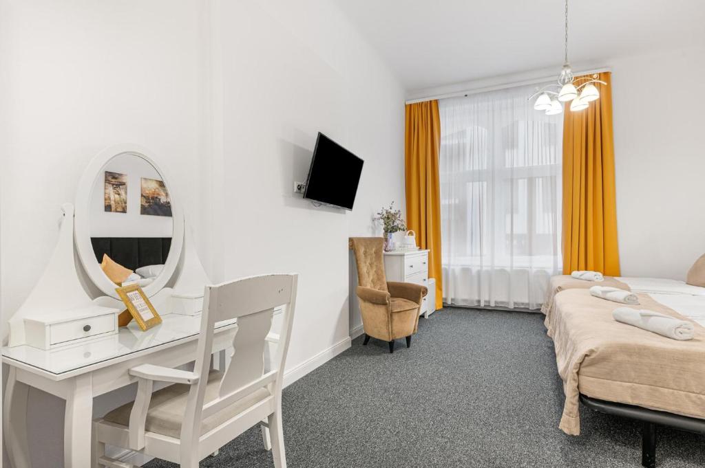 A bed or beds in a room at Downtown Bratislava B&B