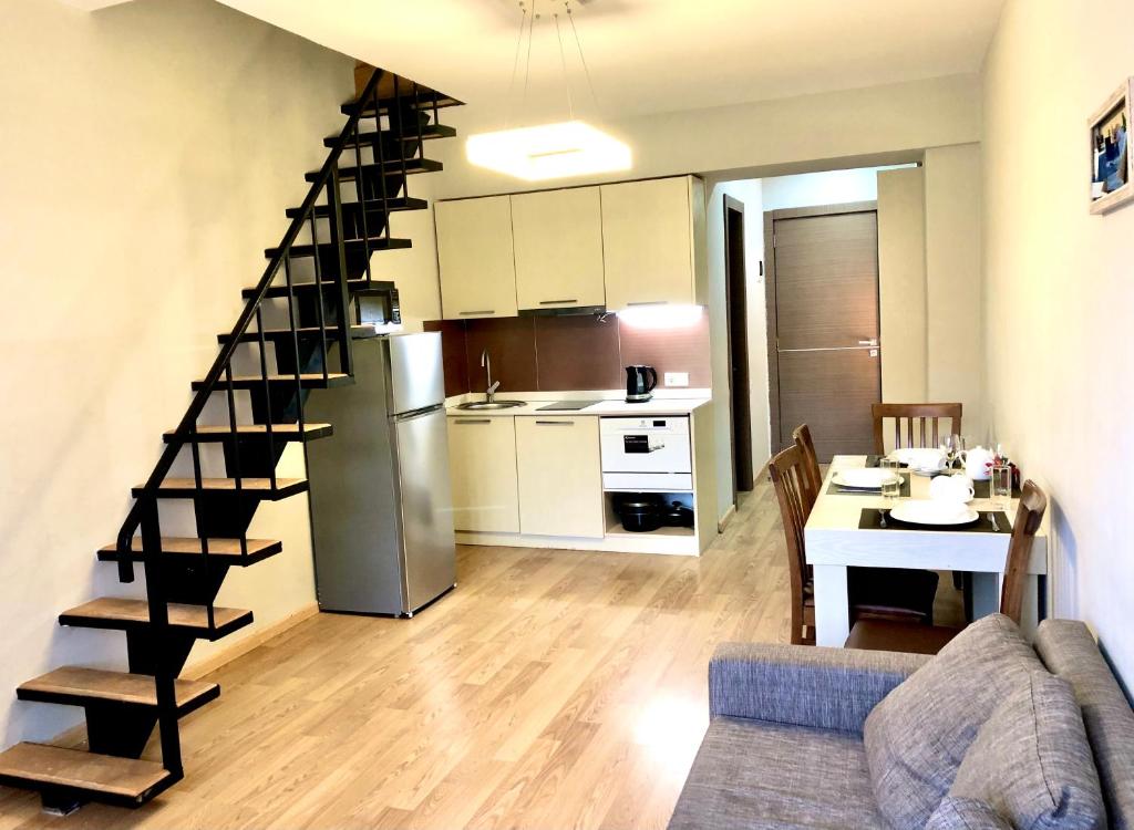 Kuchyň nebo kuchyňský kout v ubytování 3-room Apartment NFT New Gudauri 404