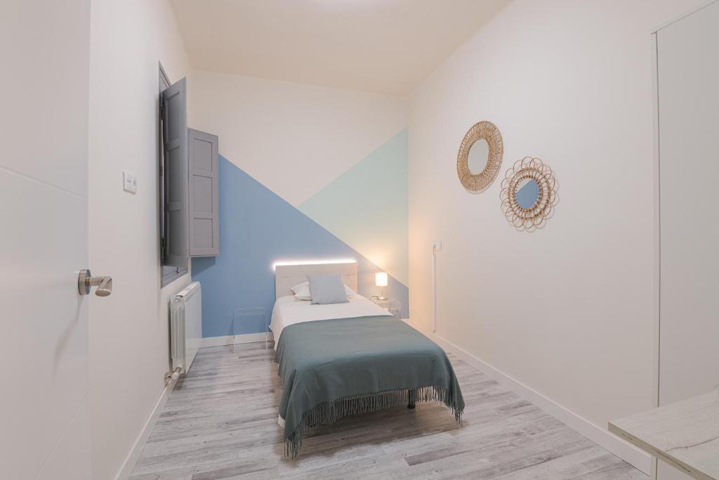 Posteľ alebo postele v izbe v ubytovaní ROOMMY