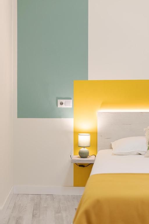 Posteľ alebo postele v izbe v ubytovaní ROOMMY