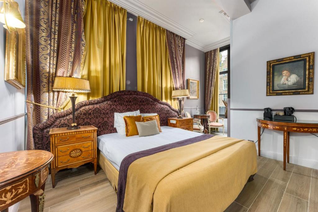 Postel nebo postele na pokoji v ubytování Canal Suites