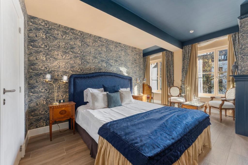 Postel nebo postele na pokoji v ubytování Canal Suites