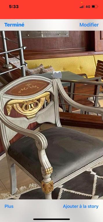 a page of a magazine with a picture of a chair at Hotel Khella in Hammamet