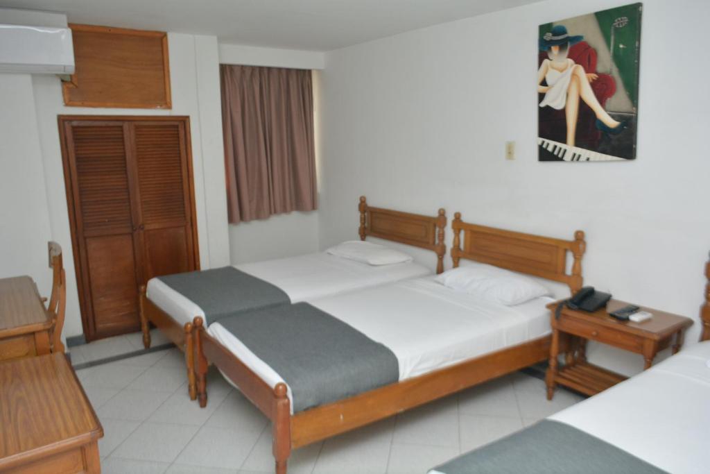 Postel nebo postele na pokoji v ubytování Hotel Casa Ballesteros
