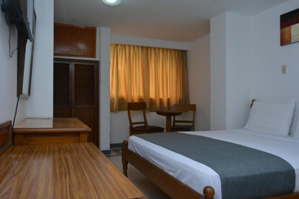 Postel nebo postele na pokoji v ubytování Hotel Casa Ballesteros